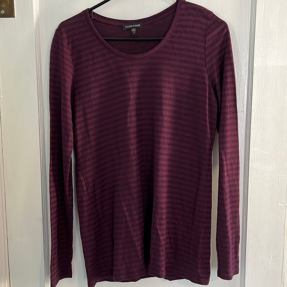 Striped, long sleeve maroon shirt.